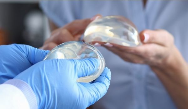 Bodybuilder's 32DD breast implants caused depression and weight gain